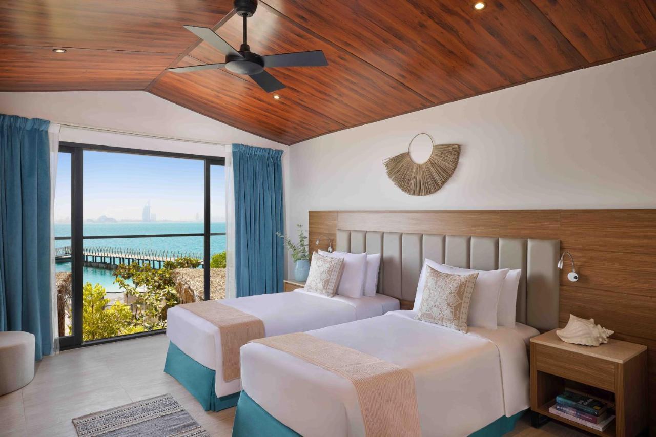 Zimmer mit Kingsize-Bett oder 2 Einzelbetten und Meerblick
