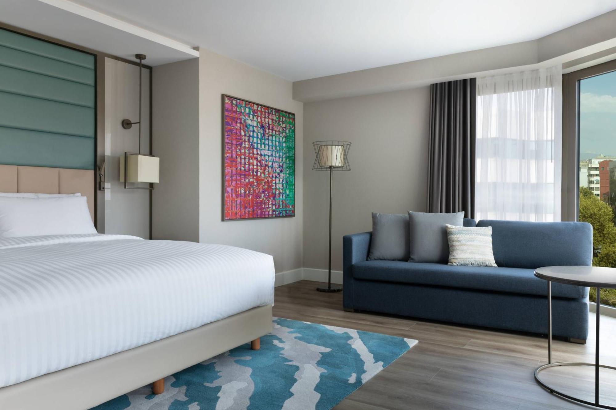 Eckzimmer mit Kingsize-Bett und Stadtblick Zugang zur Executive Lounge
